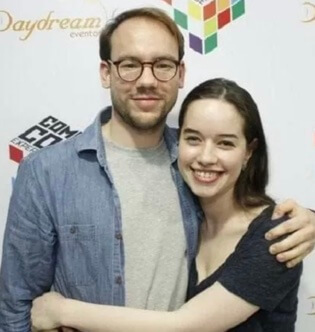 Sam Caird with his wife, Anna Popplewell.